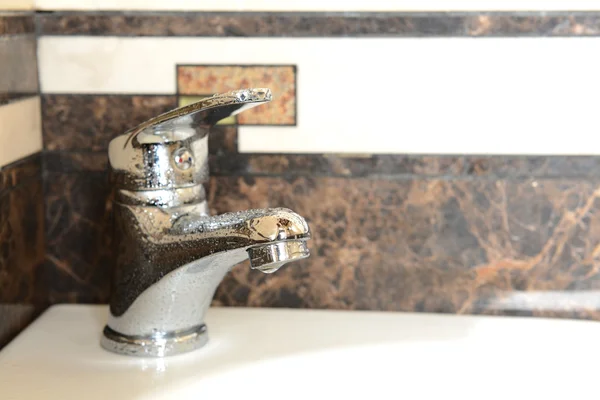 Ceramic sink with chrome fixture, close up — Stock Photo, Image