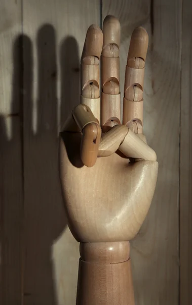 Wooden hand on wooden background — Stock Photo, Image