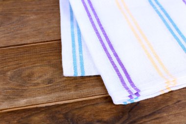 Kitchen towels on wooden background