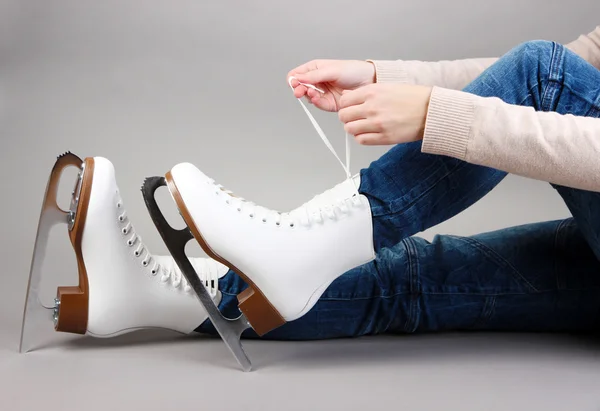 Skater wearing skates on gray background — Stock Photo, Image