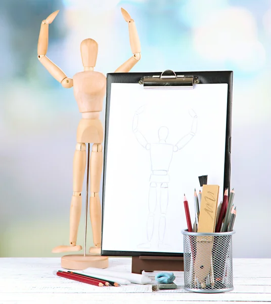 Sketch with professional art materials, on wooden table — Stock Photo, Image