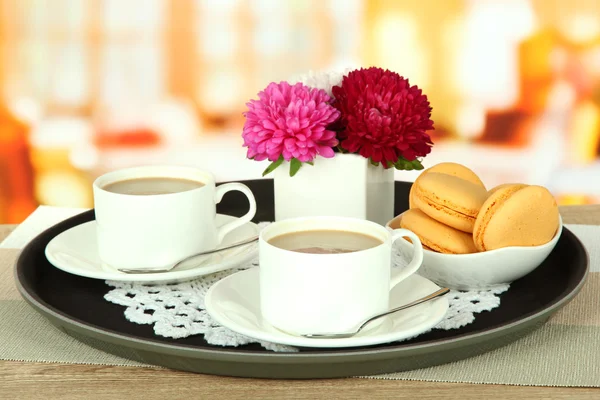 Cups of coffee on tray on table in cafe — Stock Photo, Image