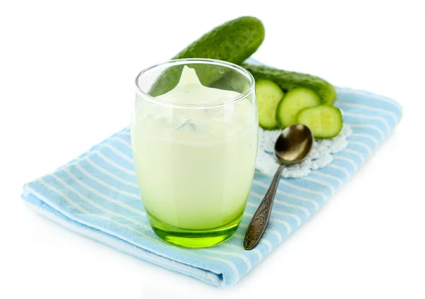 Cucumber yogurt in glass, on color napkin, isolated on white — Stock Photo, Image
