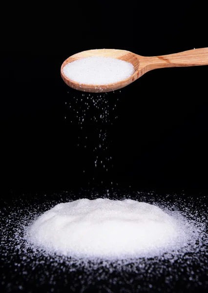 Sugar isolated on black — Stock Photo, Image