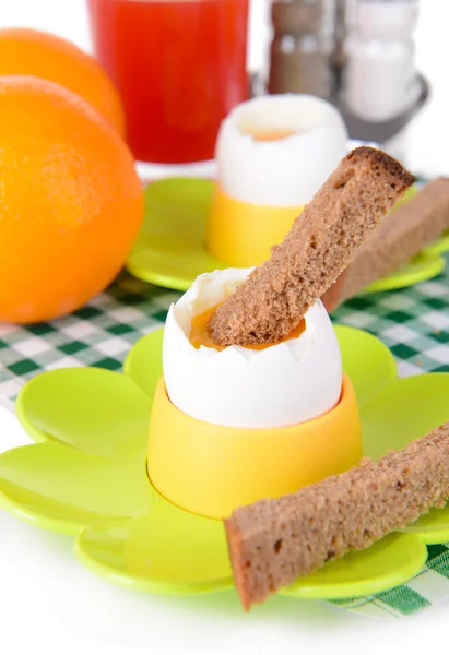 Boiled eggs in egg cups on table close-up — Stock Photo, Image