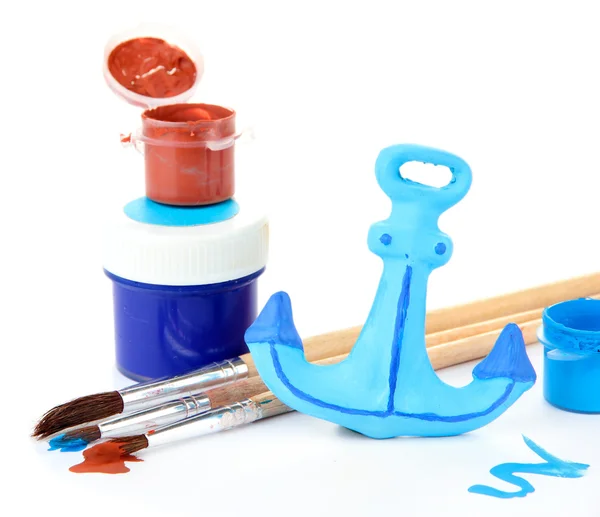 Hand made ceramic anchor and color paints isolated on white — Stock Photo, Image