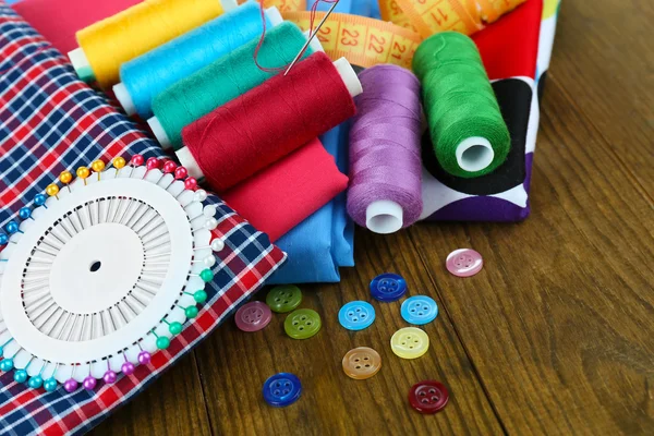 Sewing accessories on wooden table — Stock Photo, Image