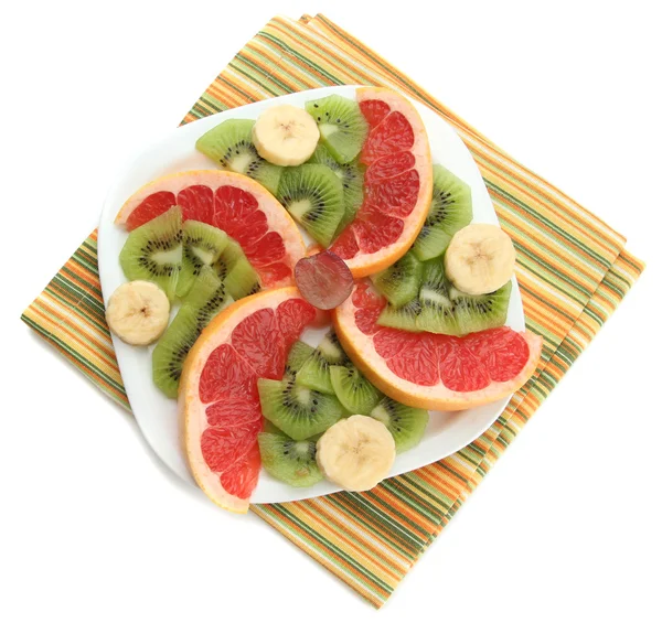 Assortment of sliced fruits on plate, isolated on white — Stock Photo, Image