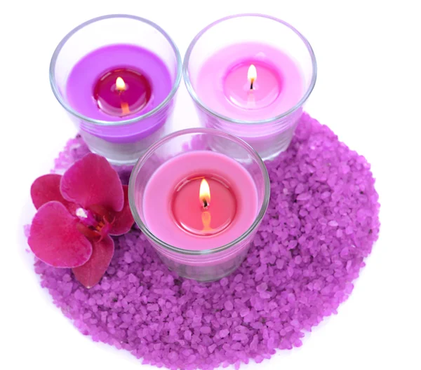 Beautiful colorful candles, orchid flower, sea salt isolated on white — Stock Photo, Image