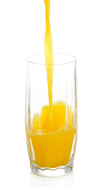 Juice pouring into glass isolated on white — Stock Photo, Image