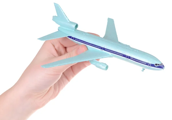 Beyaz izole elinde oyuncak uçak — Stok fotoğraf