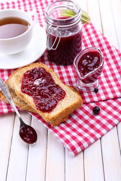 Delicious toast with jam on table close-up — Stock Photo, Image