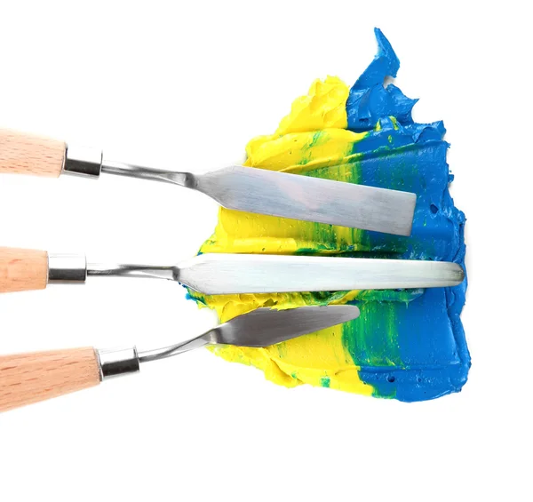 Painting palette knifes with paint isolated on white — Stock Photo, Image