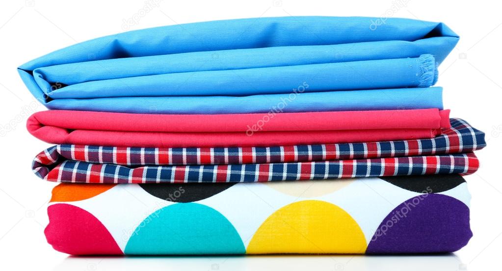 Pile of colored fabrics isolated on white