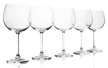 Empty wine glasses arranged and isolated on white clipart