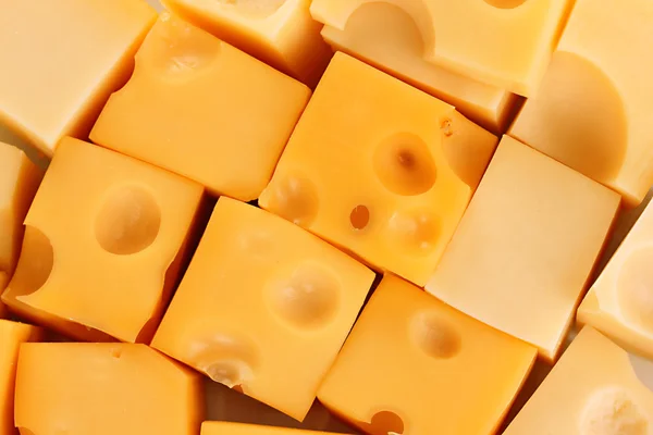 Cheese cubes background — Stock Photo, Image