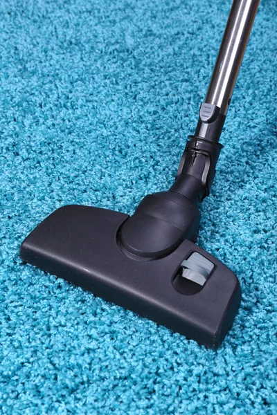 Vacuuming carpet in house — Stock Photo, Image