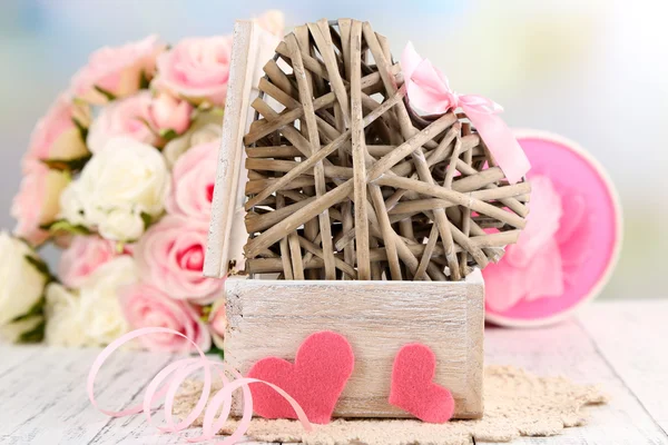 Romantic still life with heart in wooden casket — Stock Photo, Image