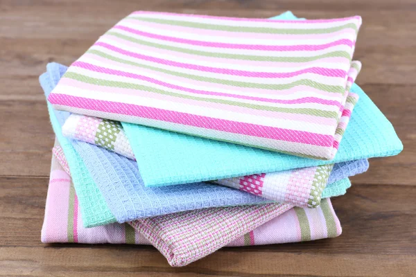 Kitchen towels on wooden background — Stock Photo, Image