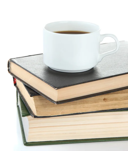 Taza de café y libros aislados en blanco — Foto de Stock