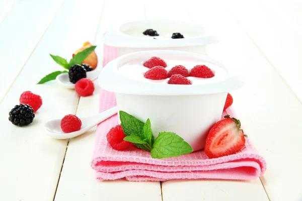 Delicious yogurt with fruit and berries on table close-up Royalty Free Stock Images