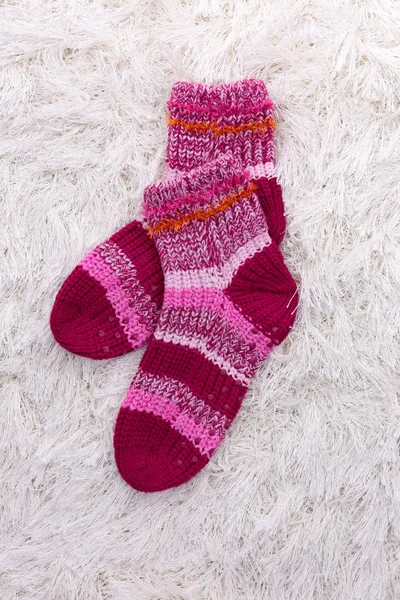 Woolen socks, on color background — Stock Photo, Image