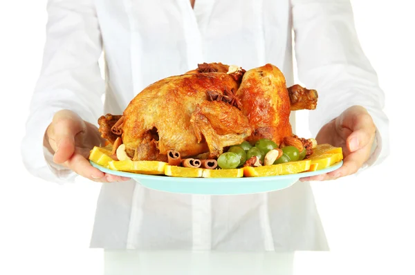 Chef holding a plate of baked chicken with fruit and spices close-up — Stock Photo, Image