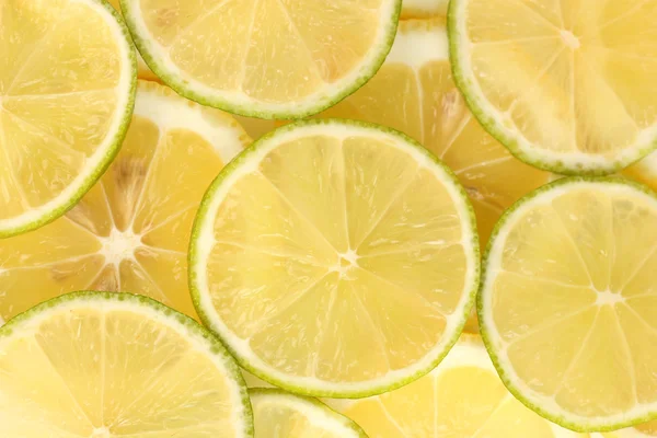 Kireç ve limon dilimleri arka plan — Stok fotoğraf