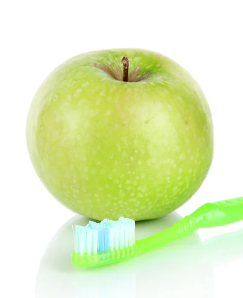 Apple with a toothbrush isolated on white — Stock Photo, Image