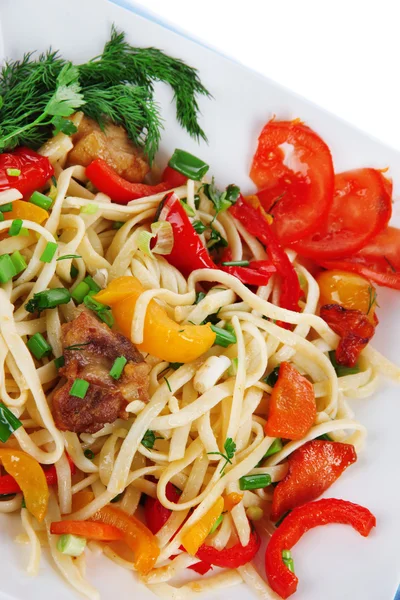 Noodles with vegetables on plate close-up — Stock Photo, Image