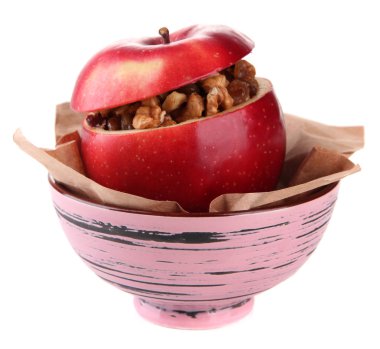 Kuru üzüm ve fındık üzerinde beyaz izole kase ile elma