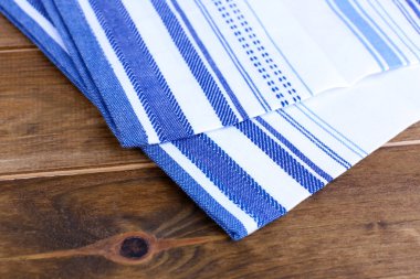 Kitchen towels on wooden background