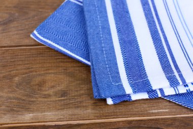 Kitchen towels on wooden background
