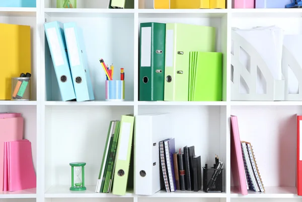 White office shelves with folders and different stationery, close up — Stock Photo, Image