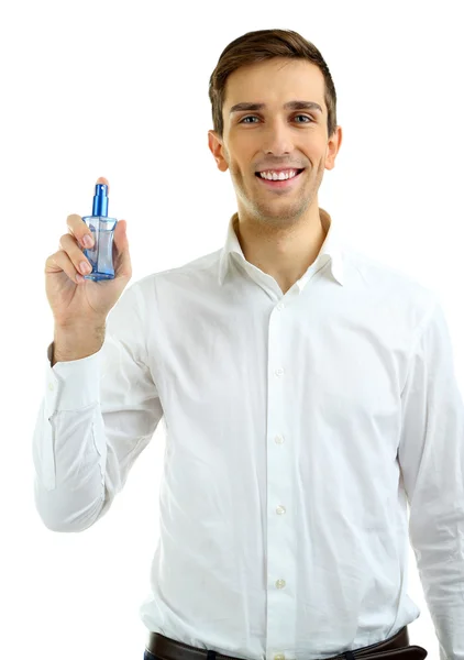 Schöner junger Mann mit Parfüm isoliert auf weiß — Stockfoto
