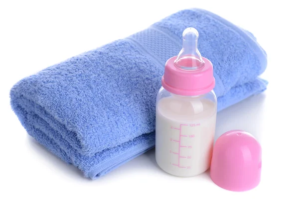 Baby bottle with milk and towel isolated on white — Stock Photo, Image