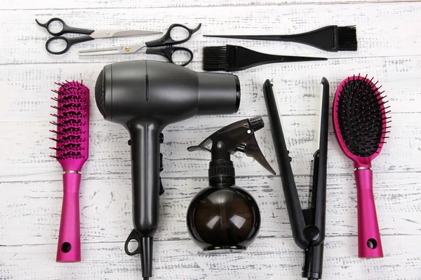 Hairdressing tools on white wooden table close-up — Stock Photo, Image