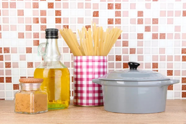 Products for cooking in kitchen on table on mosaic tiles background — Stock Photo, Image