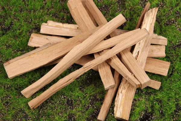 Stack of firewood on grass close up — Stock Photo, Image