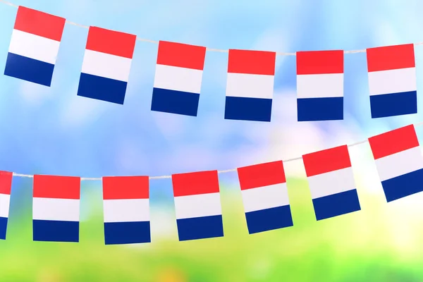 Garland of flags on bright background — Stock Photo, Image