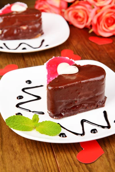 Sweet cakes with chocolate on plate on table close-up — Stock Photo, Image