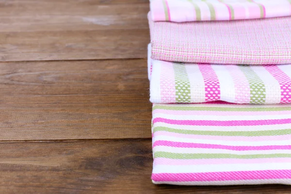 Kitchen towels on wooden background — Stok fotoğraf