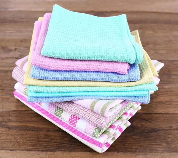 Kitchen towels on wooden background — Stockfoto