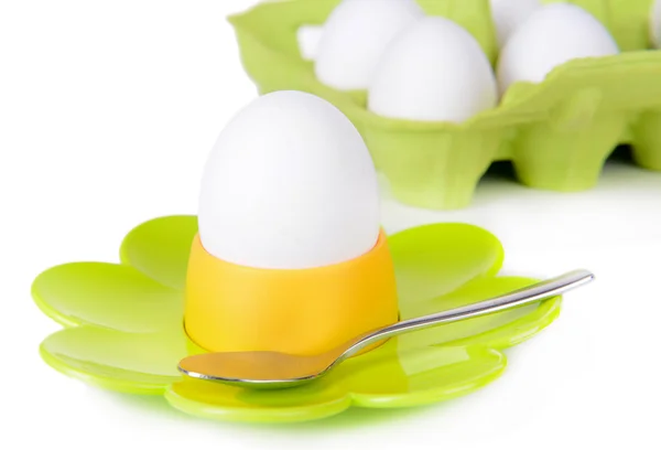 Huevos cocidos en tazas de huevo aisladas sobre blanco —  Fotos de Stock