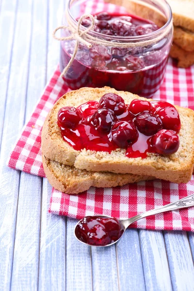 Delicious toast with jam on table close-up — Stock Photo, Image