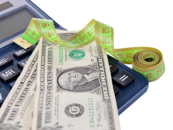 Misura del nastro con il denaro e la calcolatrice primo piano — Foto Stock