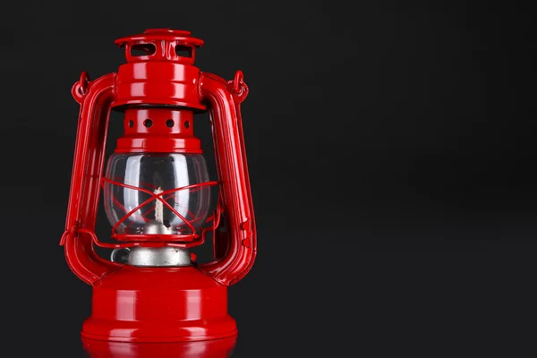 Red kerosene lamp on black background — Stock Photo, Image