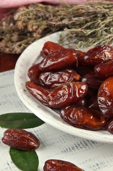 Dried dates on plate on table close up — Stock Photo, Image