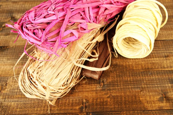 Decorative straw for hand made, on wooden background — Stock Photo, Image