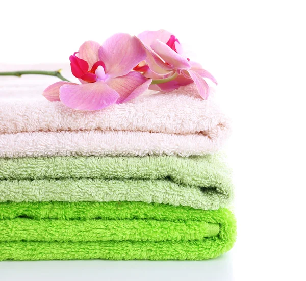 Orchid flower and towels, isolated on white — Stock Photo, Image